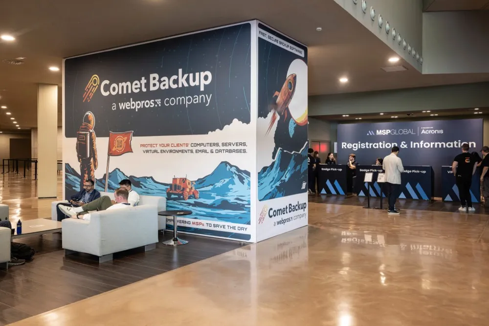 The Comet Backup booth lounge area at MSP Global 2025